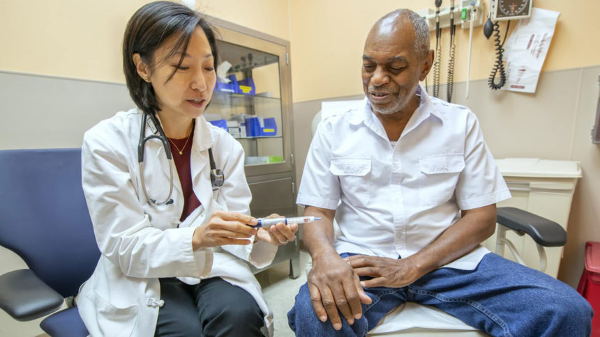 Mary Rhee with patient